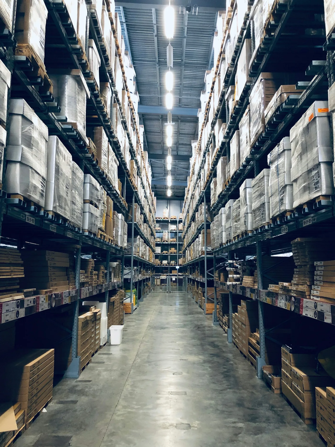 Distribution warehouse aisle with stocked pallets