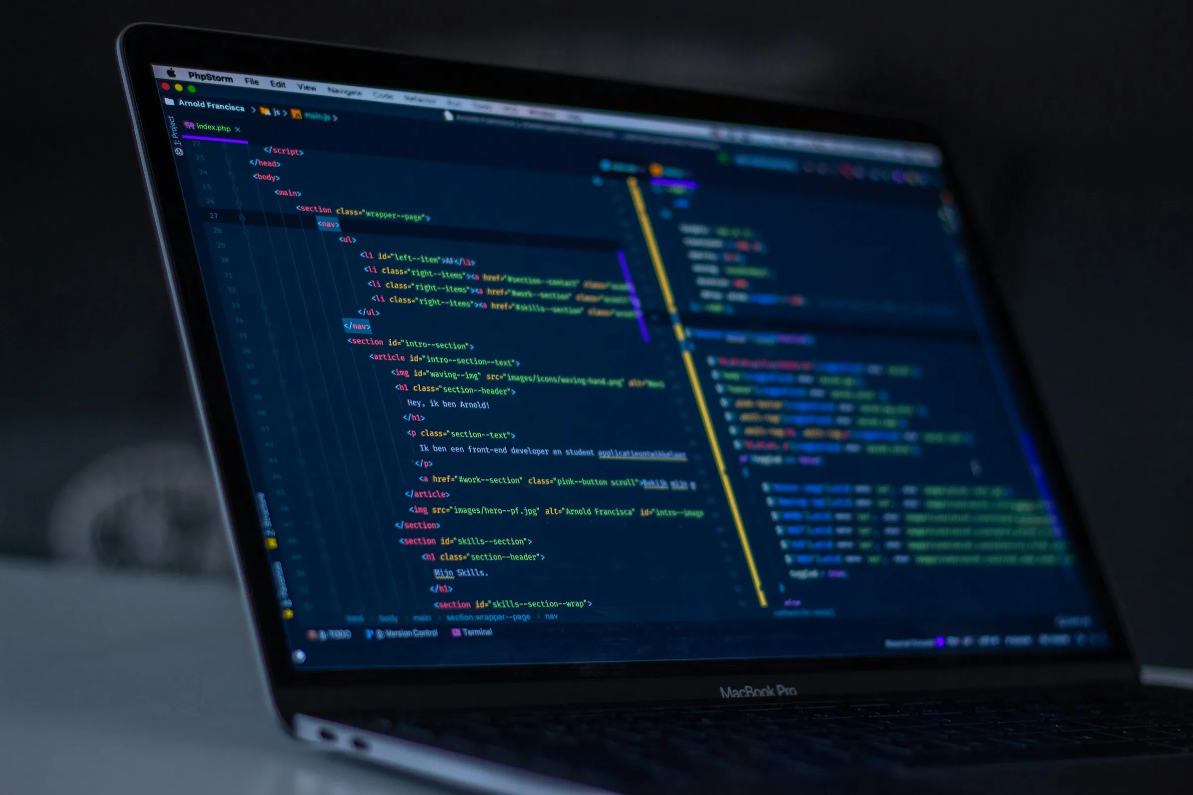 Code editor with markup and string files open on a laptop