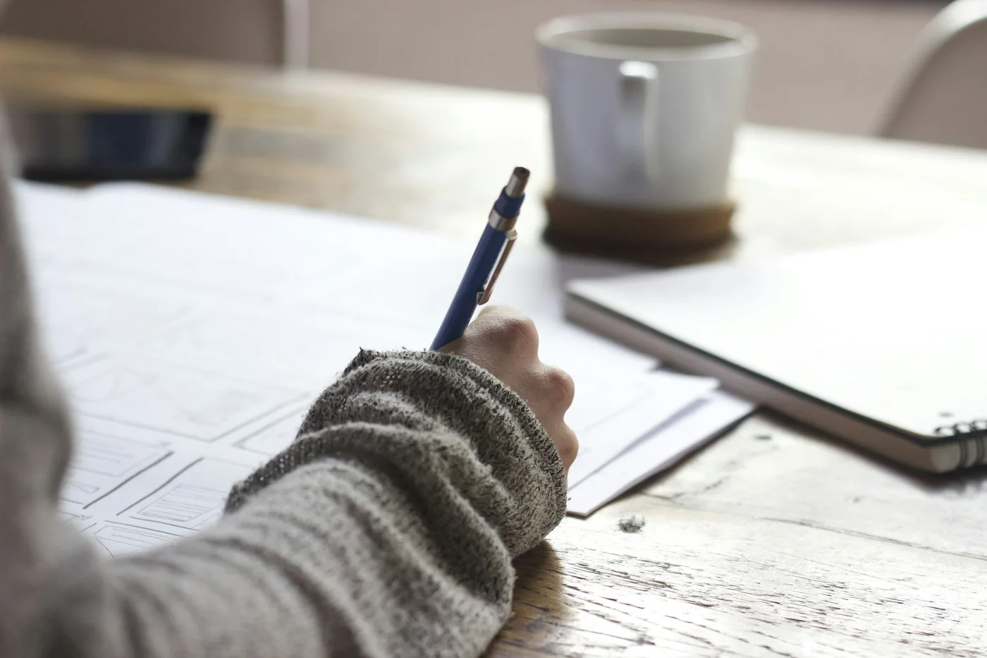 Translator working with reference material at a desk